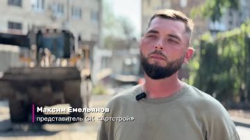 На улице Красных Шахтёров в Краснодоне укладывают нижний слой асфальта